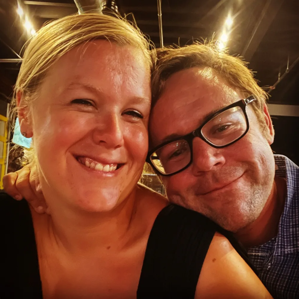 Carrie and Dale smiling together in a close-up selfie